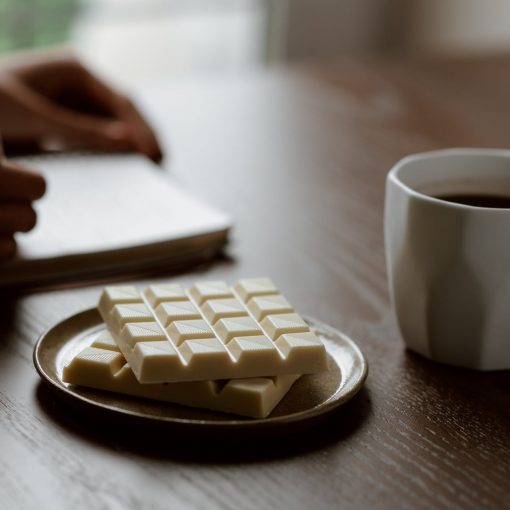 photo of person writing on notepad