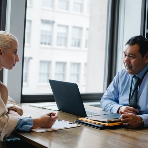 focused ethnic male boss interviewing applicant in office