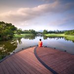 person sitting on dock