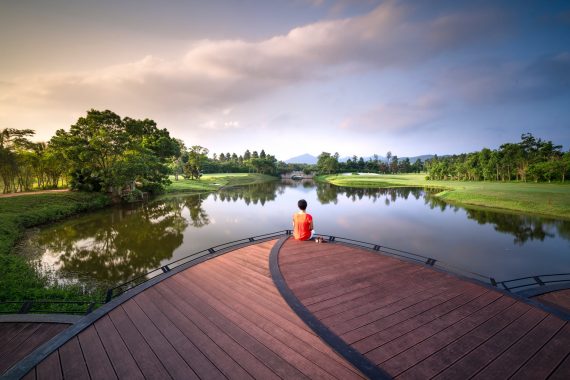 person sitting on dock