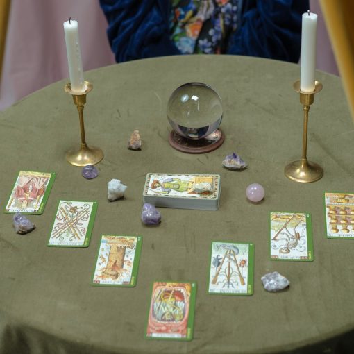 tarot cards and a crystal ball on the table