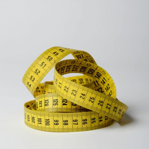close up photo of yellow tape measure