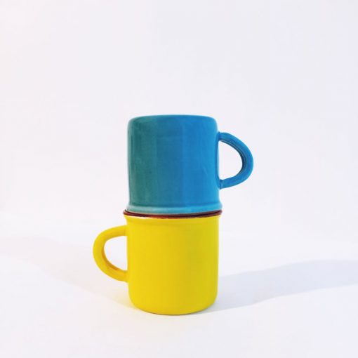 colorful stacked blue and yellow mugs