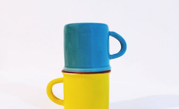 colorful stacked blue and yellow mugs
