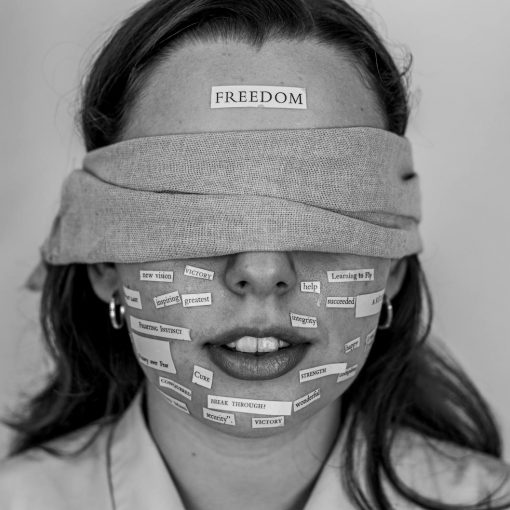 close up photo of blindfolded woman