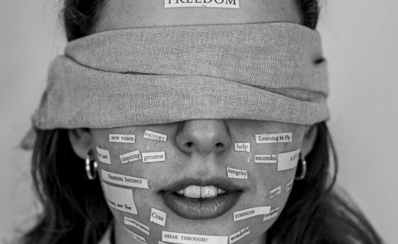 close up photo of blindfolded woman