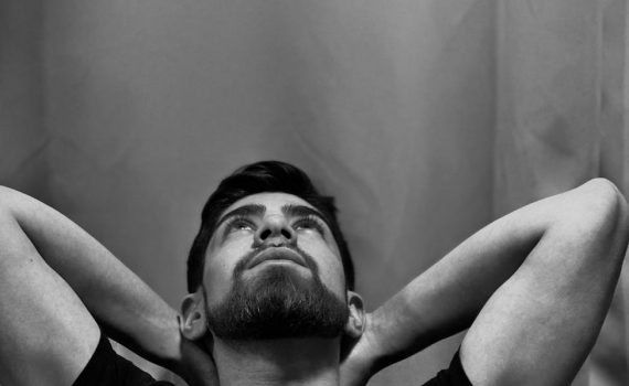 young man staring at the ceiling